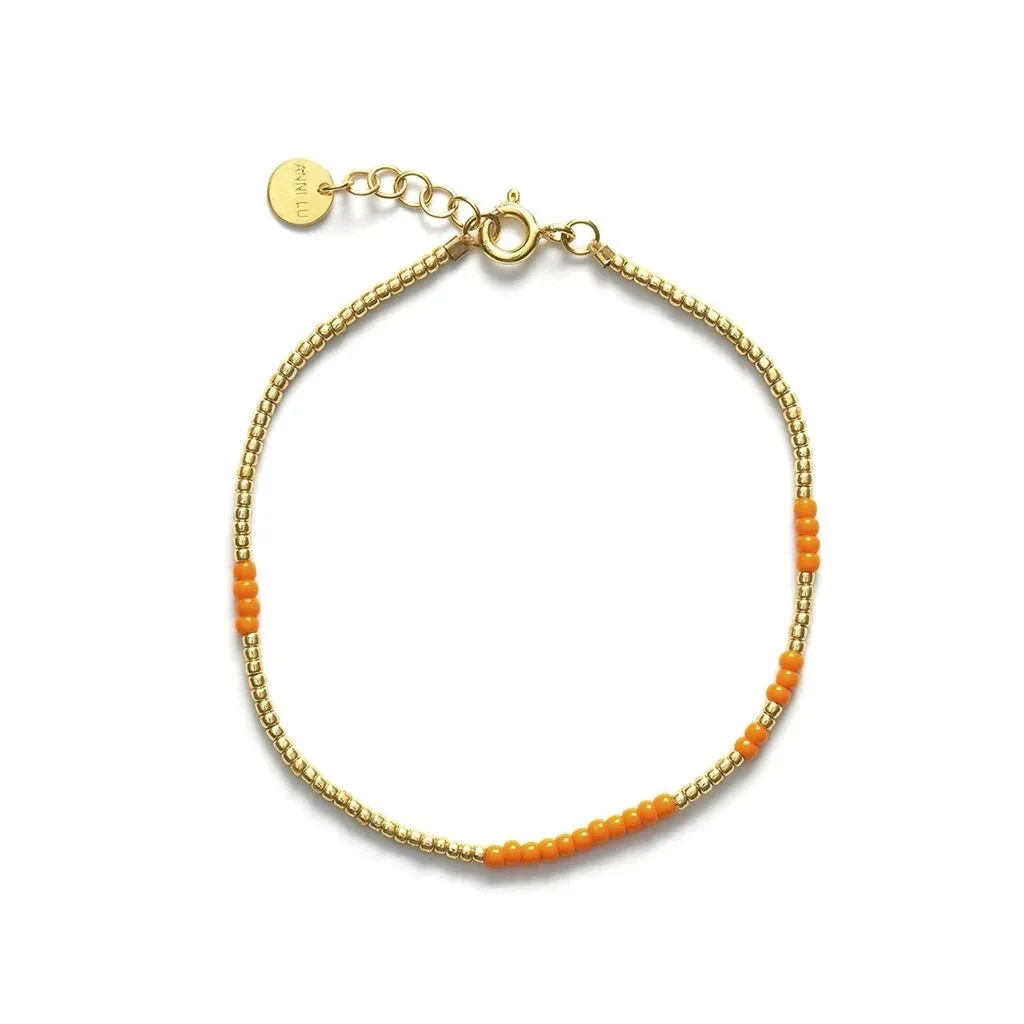 Asym Gold Plated Bracelet w. Orange Beads